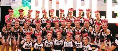 The KHS cheerleaders pose during a competition at Jerome High School. | Photo via Jaci Cowger