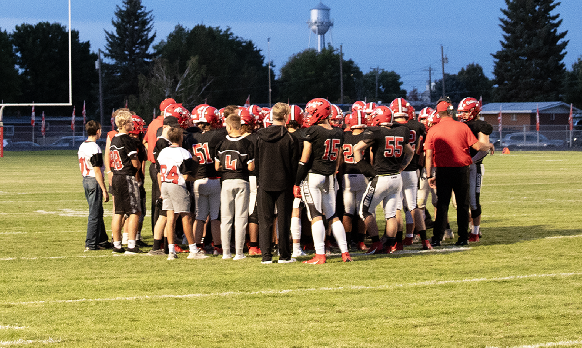 The KHS football team talks during a timeout during a game against Fruitland. | Photo by Hayley Daniels