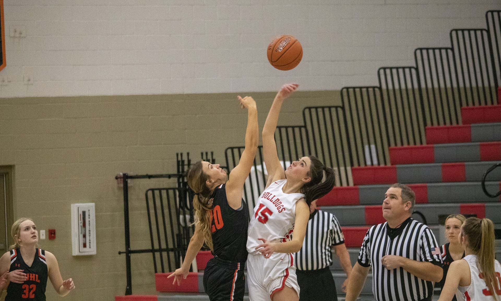 Senior Kelsy Stanger tips off during a game against Buhl this season. | Photo by Staff