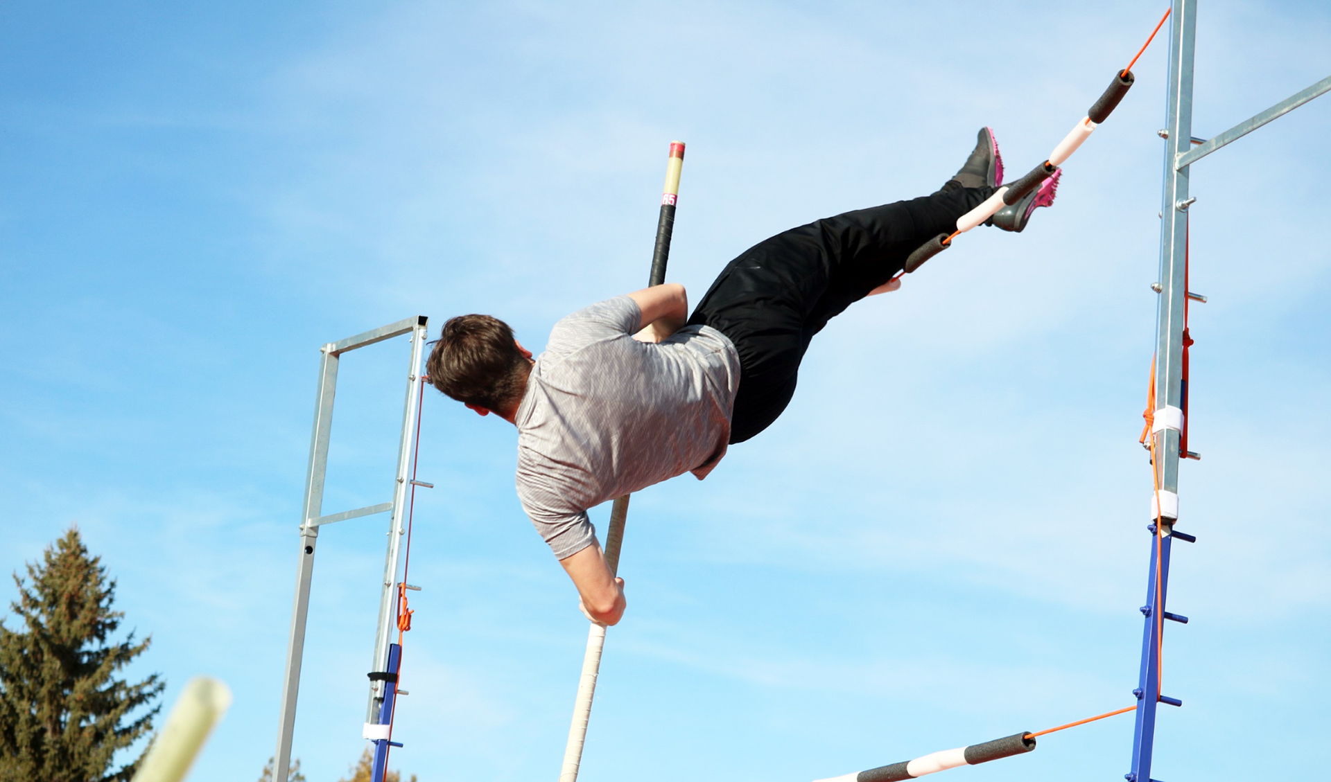 Senior Nolan Klimes pole vaults during practice. | Photo by Jaci Cowger Senior Nolan Klimes pole vaults during practice. | Photo by Jaci Cowger