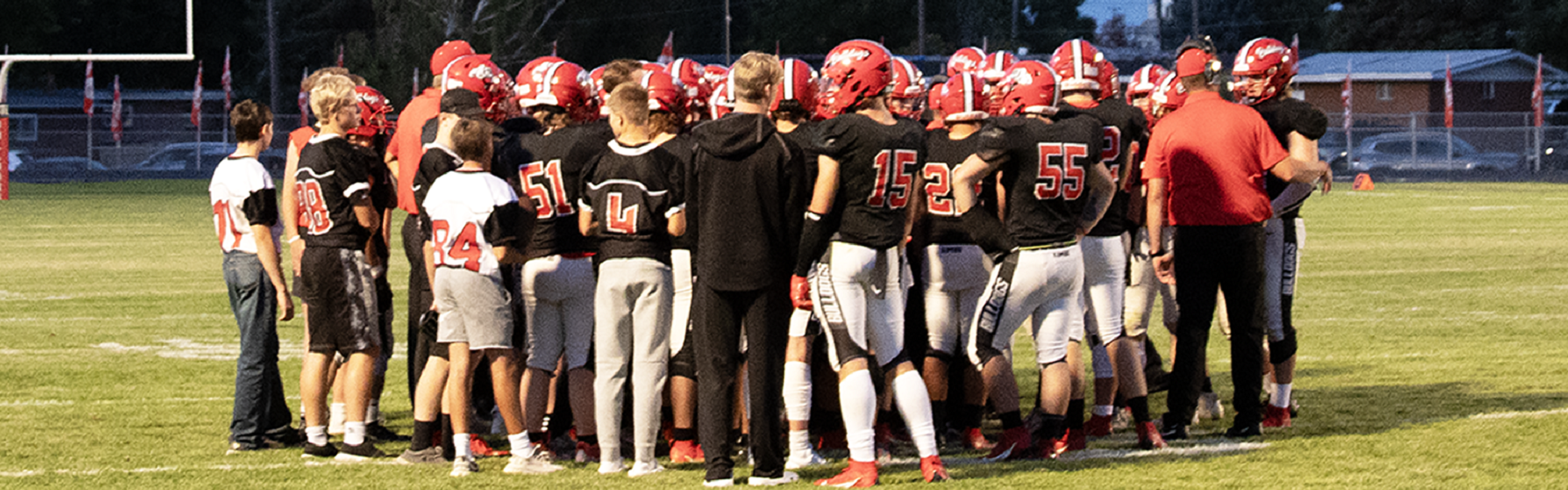 The KHS football team talks during a timeout during a game against Fruitland. | Photo by Hayley Daniels