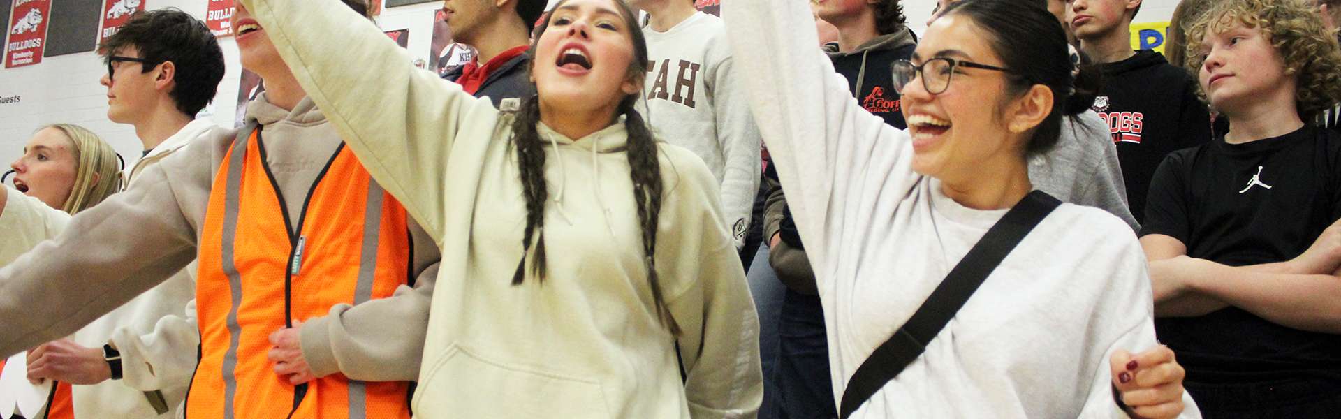 Seniors Anna Solomon (left) and Noelia Juarez cheer during a boys basketball game against Buhl this season. | Photo by Kaya Thomas