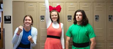 Mrs. Crockett (Bubbles), Miss Klahman (Blossom), and Mr. Bedke (Buttercup) pose as the Powerpuff Girls on Halloween. | Photo by Paizlee Goff