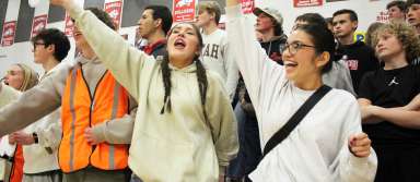 Seniors Anna Solomon (left) and Noelia Juarez cheer during a boys basketball game against Buhl this season. | Photo by Kaya Thomas